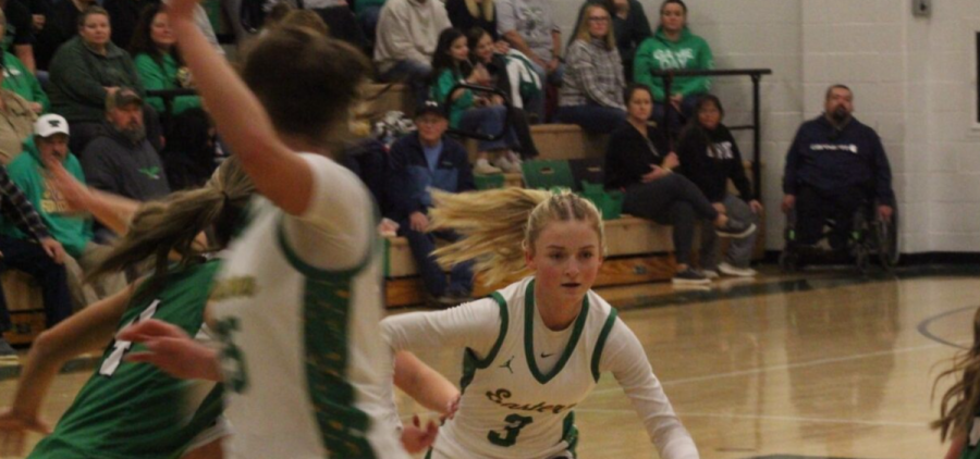 Kyrstin Fackler driving into the midrange as she is being defended.