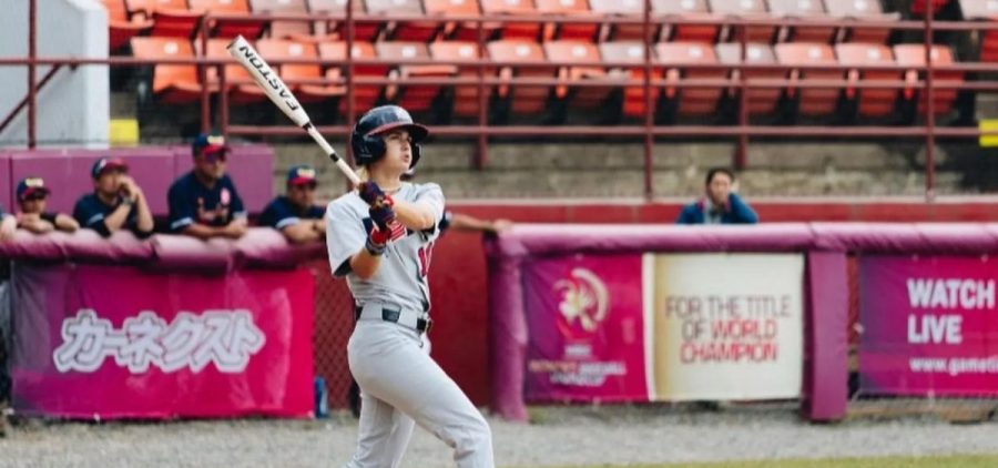 London Studer watches, presumably, a baseball after it is hit by her.