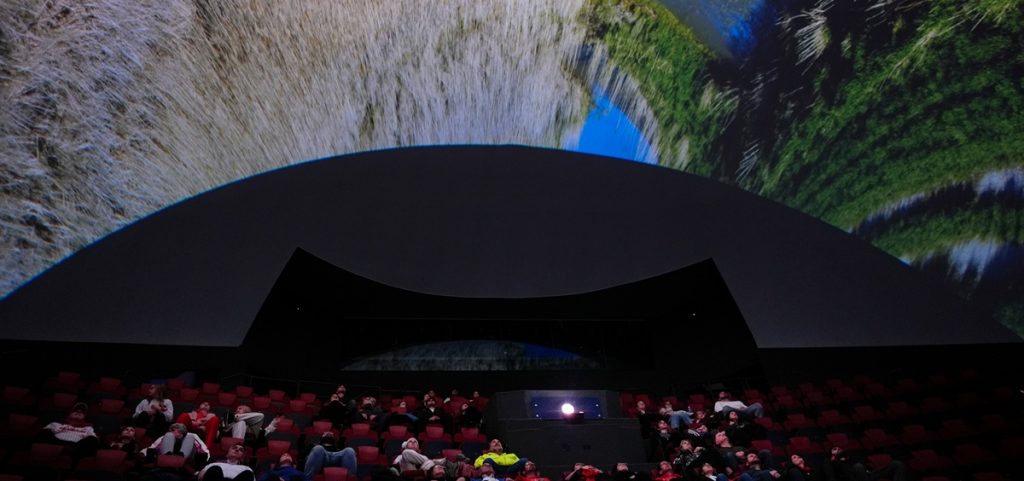 Audience members watch "Ohio: Wild at Heart" that features the state's top-rated park system to highlight wildlife conservation efforts and the restorative power of outdoor recreation at the Robert D. Lindner Family OMNIMAX Theater