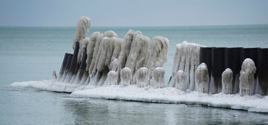 Ice forms on a pier along Lake Michigan on a cold Wednesday