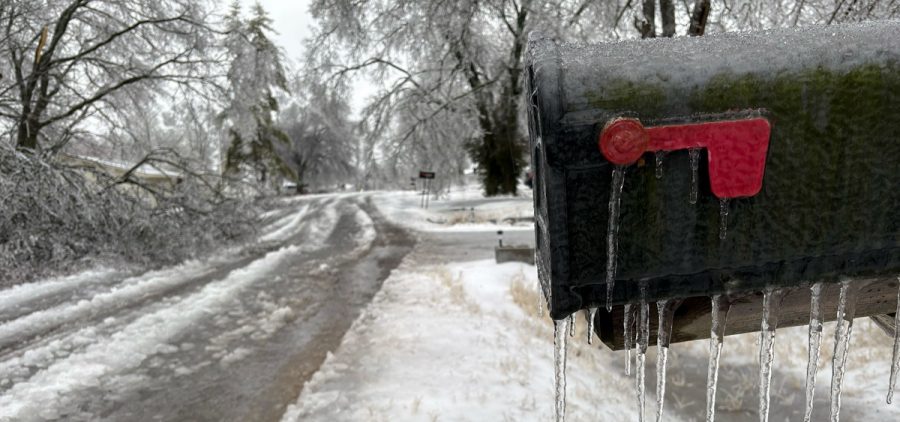 Icicles form on a mailbox on a neighborhood street as a winter storm moves through.