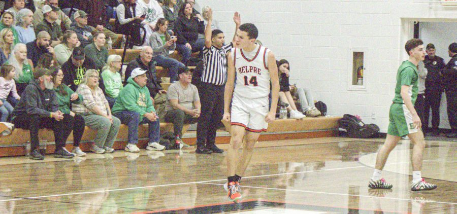 Malik Currie celebrates after a buzzer beater against the Eastern Eagles.