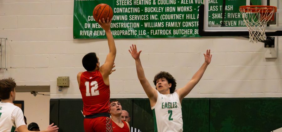Trimble's Brady Jajczyk goes up with a floater against Eastern.