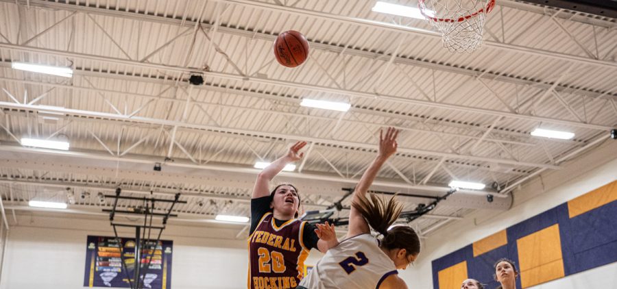 Takira Walker Blocking Neveah Camp on a shot attempt.