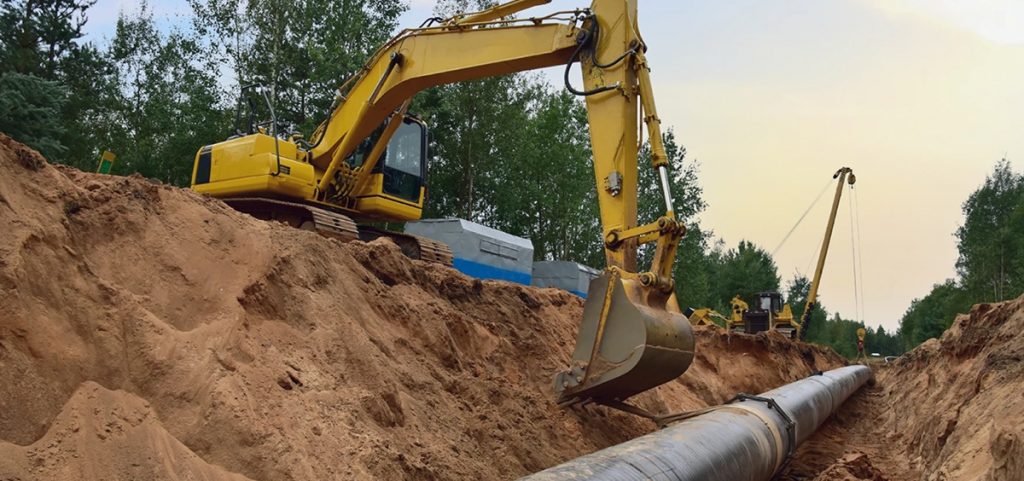 Ohio workers excavate a pipe.