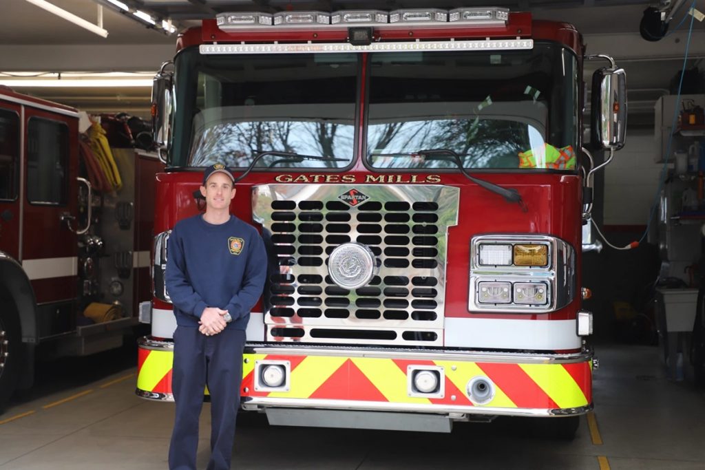 Gates Mill Fire Captain Mike Feig stands in front of one of the department’s three fire engines