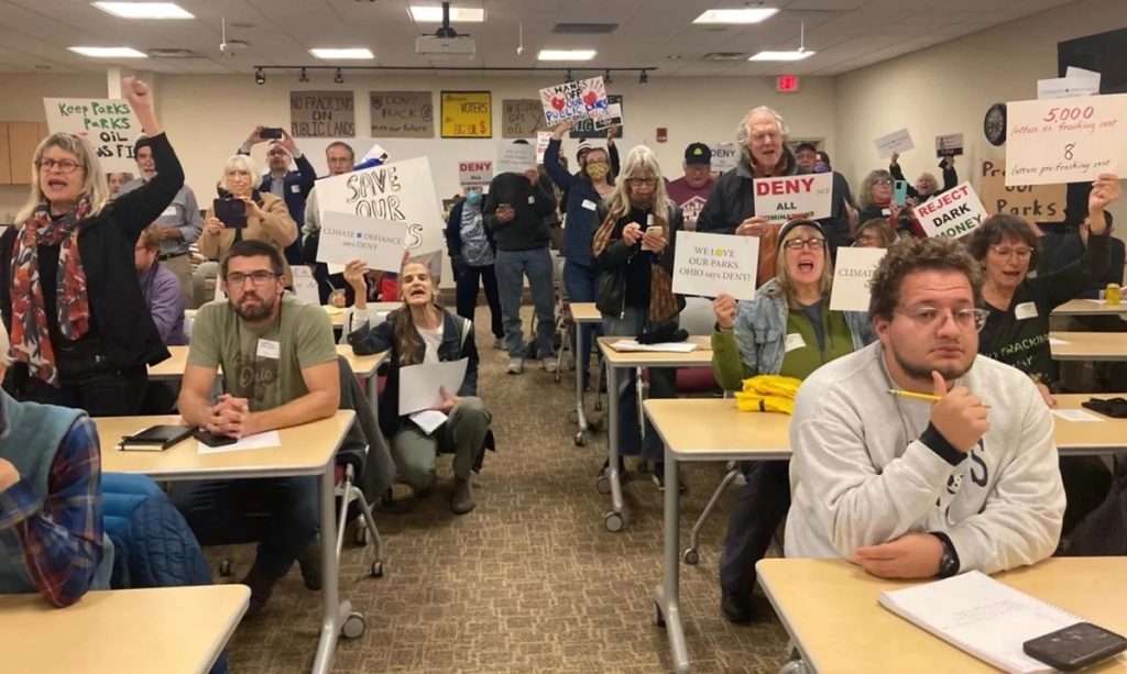Protesters gathered at a meeting of the Oil and Gas Land Management Commission in Columbus, November 15, 2023 to express concerns about fracking on state lands.