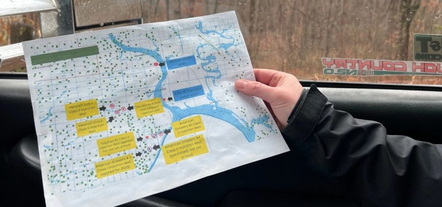 Bev Reed, with the Buckeye Environmental Network, holds a map showing injection well sites near Marietta in southeast Ohio.