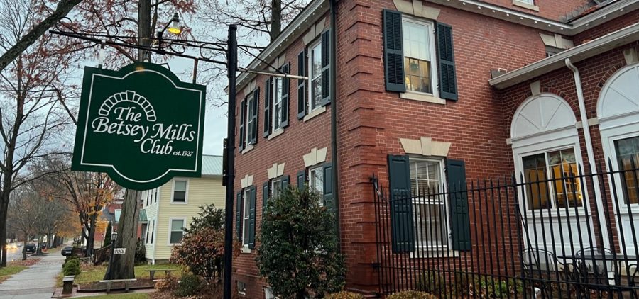 The Betsey Mills Club building sign and building from the outside.