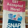 A sign shows electronic benefit transfer (EBT) cards used for SNAP benefits is accepted at a store in Columbus.