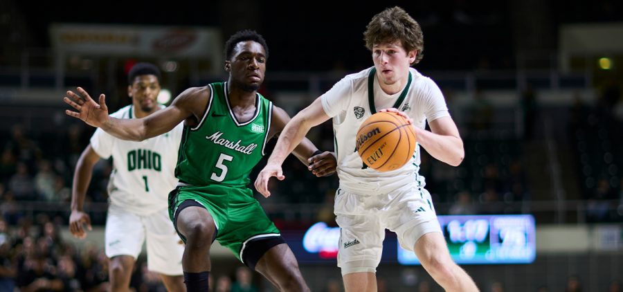 Jackson Paveletzke dribbles inside the arc vs. Marshall on Dec. 6, 2025