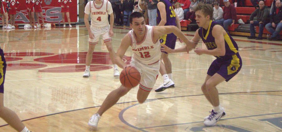 Brady Jajczyk drives towards the paint against the Southern Tornadoes.
