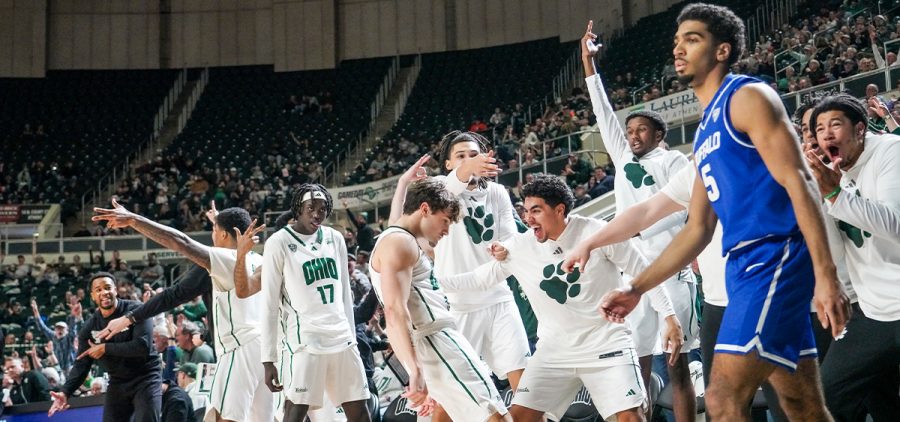 Players on Ohio's bench celebrate after Ajay Sheldon makes a three pointer.