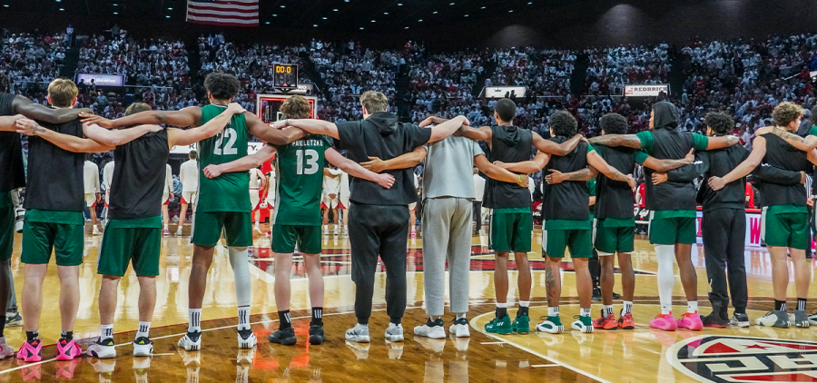 The Ohio Men's Basketball team standing together pregame against Miami.