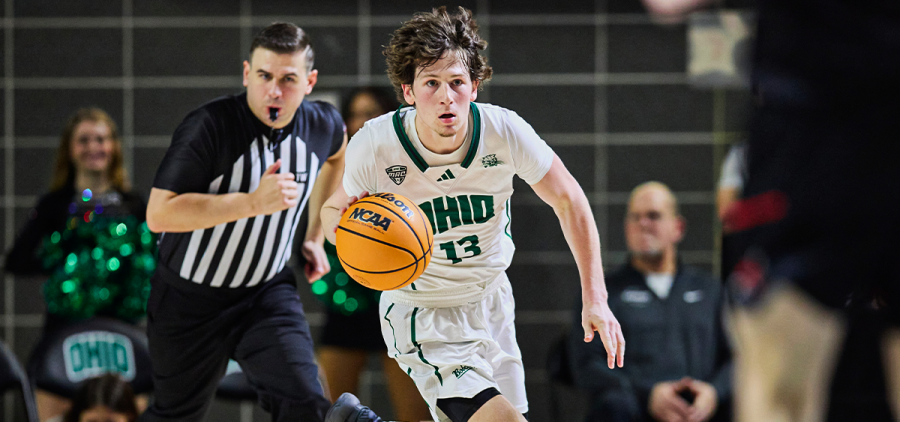 Ohio Men's Basketball guard Jackson Paveletzke bringing the ball up the court against Ball State.