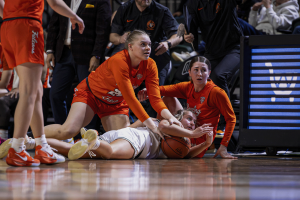 Ohio Women's Basketball guard Bella Ranallo diving on the floor for a loose ball.