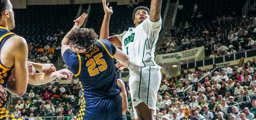 Ohio Men's Basketball forward Javan Simmons going up for a layup over Toledo forward Austin Parks.