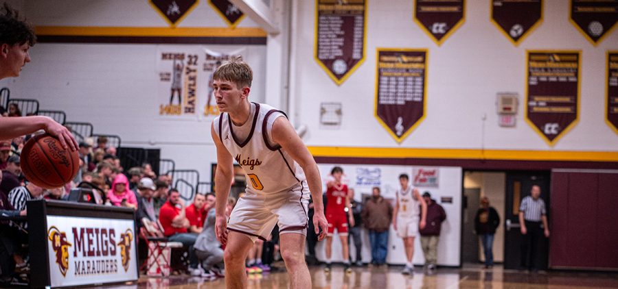 Owen Tracy looks to defend a Westfall Mustang offensive player.