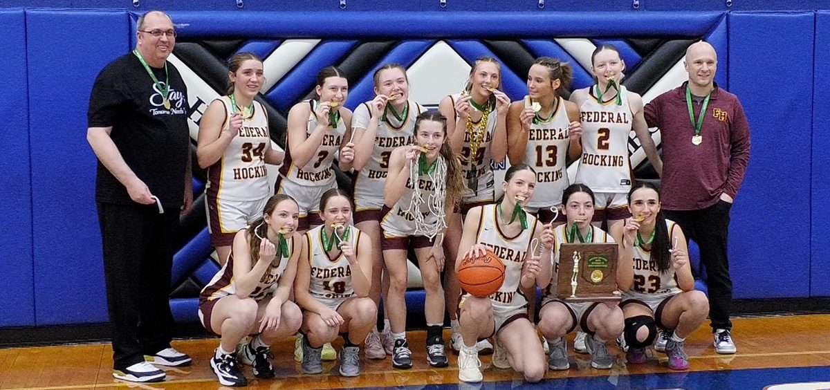 The Federal Hocking Lady Lancers pose for a photo after winning the District Championship.