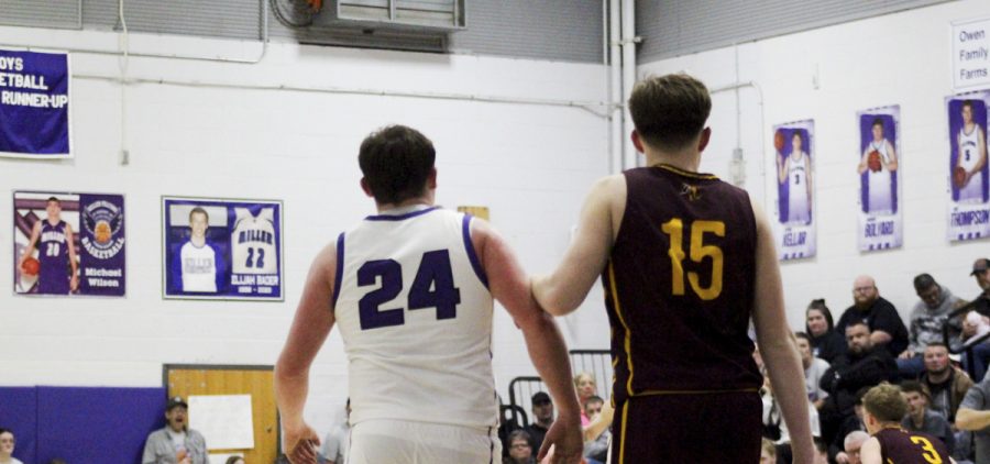 The Federal Hocking defender prepares to guard the Miller Falcons' player.