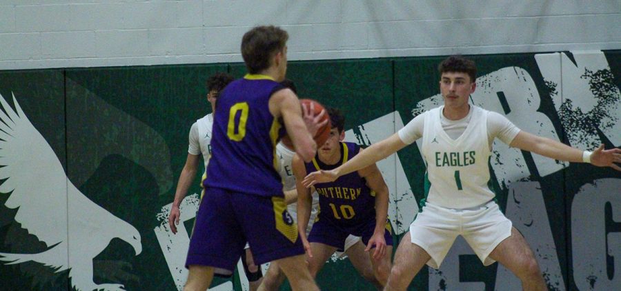 Southern player looks for an open teammate to pass to ask Eastern defenders look to close the opportunities.