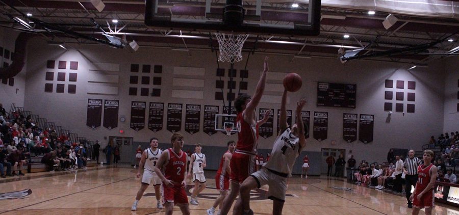 Vinton County Viking goes up for a tough layup against a Jackson Ironmen defender.