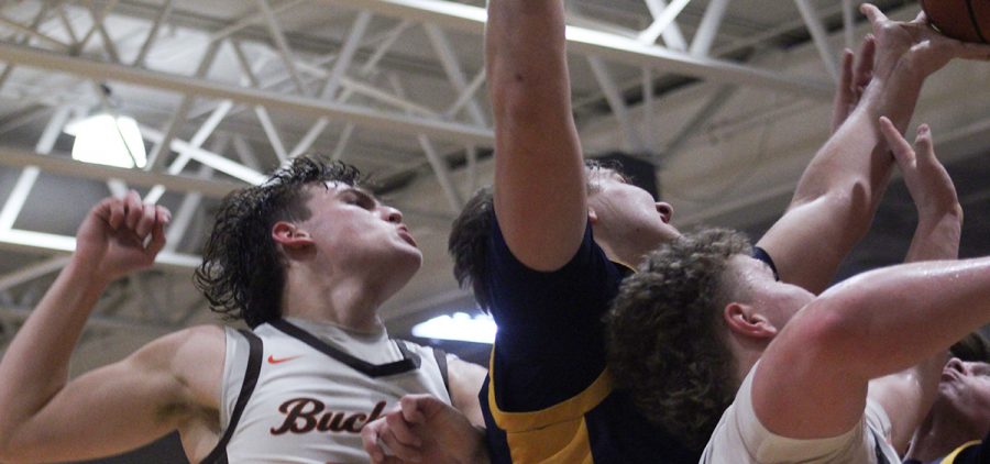 Wes Briggs goes up for a rebound with a host of Buckeye defenders around him.