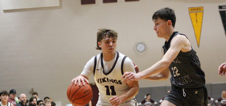 Josh Montgomery drives to the basket with a River Valley.