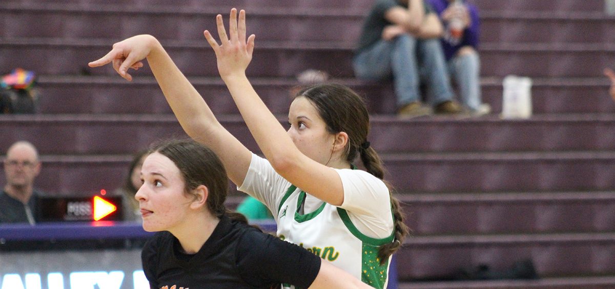 The Lady Eagle gets boxed out by a Whiteoak defender after she shoots a free throw.