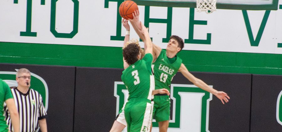 Two Eagles defenders go up to try and block the Huntington player's layup.