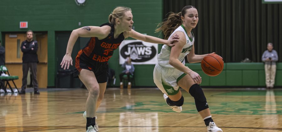 Waterford player blows by Belpre player to get to the basket.