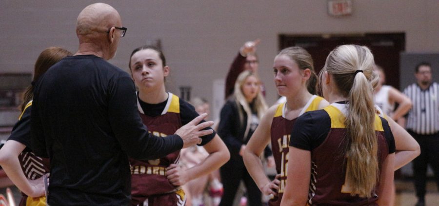 The Meigs girls team in the huddle with their coaching talking about the gameplan.