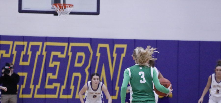 Kyrstin Fackler takes the ball up the court against Southern.