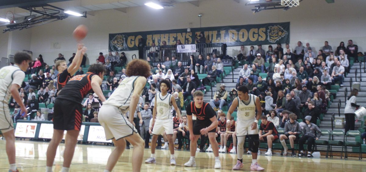 Nelsonville-York player shoots a free throw in front of the Athens student section during their game against Athens.