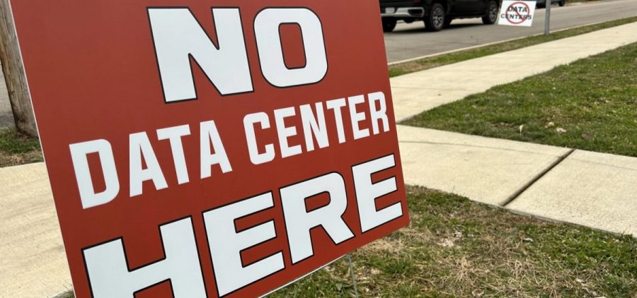 Signs opposing a data center north of Ashville, Ohio line the streets of that village.