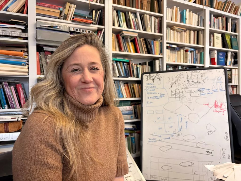 Katharine Elkins sits in her office at Kenyon College's campus