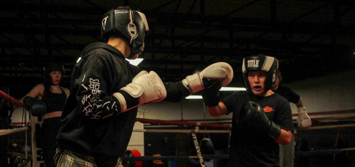 Lynix Lemtz, 13, left, spars with Chris Dennis, 11, during an evening practice at the Zanesville PAL boxing gym.