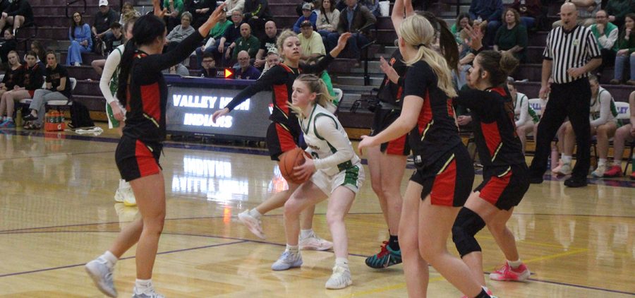 The Lady Eagle gets surrounded by all five players from South Gallia.