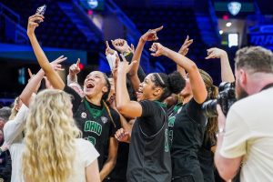 The Ohio Women's Basketball team celebrating their MAC Tournament victory over Central Michigan.