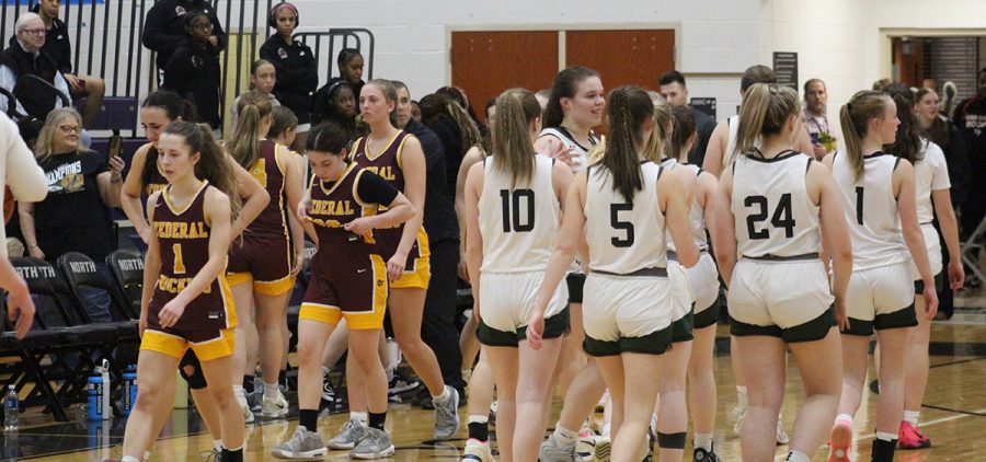 The Lady Lancers walk off the court for the last time this season after their loss.