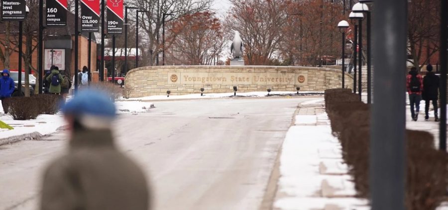 Students walk on the campus of Youngstown State University