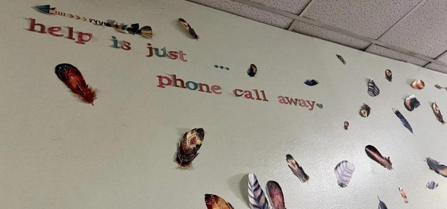 The feathers on the wall at the Talbert House, a crisis call center in Cincinnati, are reminders of the lives they've saved.