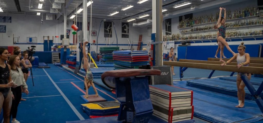 Gymnasts from the Brecksville-Broadview Heights Bees team practice in advance of the 2024 OHSAA championships.