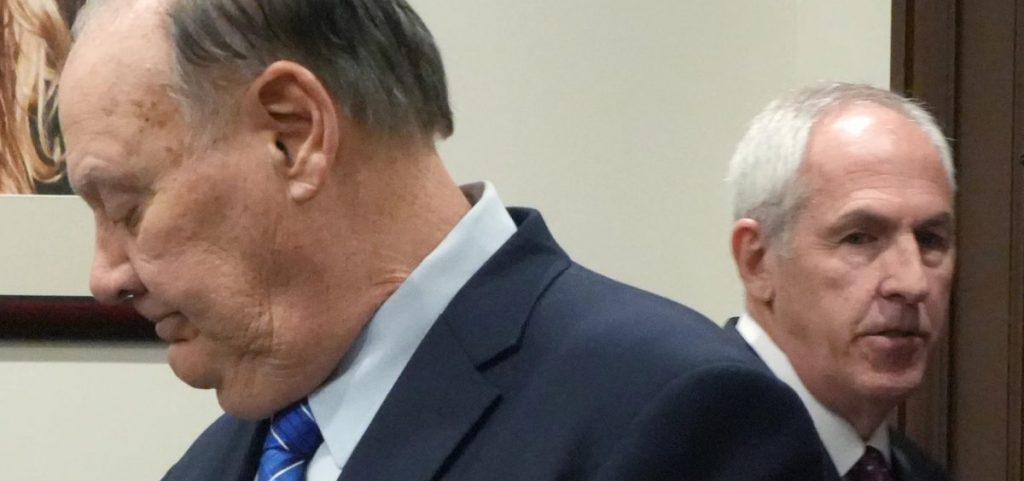 Defendants former FirstEnergy CEO Chuck Jones and ex-FirstEnergy Senior Vice President Michael Dowling wait for a hearing to resume in Summit County Common Pleas Judge Susan Baker Ross’ courtroom