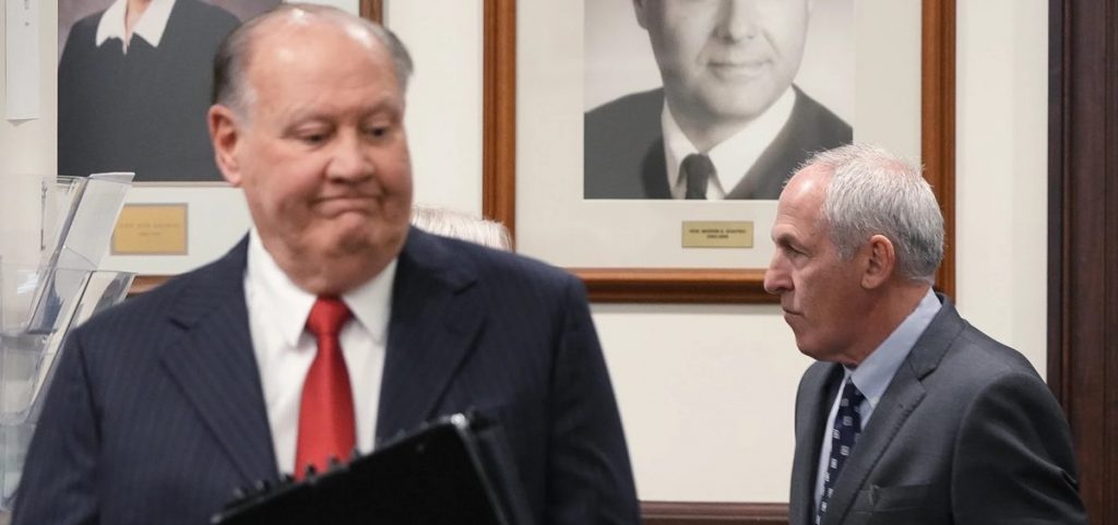 Defendants former FirstEnergy CEO Chuck Jones and ex-FirstEnergy Senior Vice President Michael Dowling enter the courtroom in Summit County Common Pleas Judge Susan Baker Ross’ courtroom