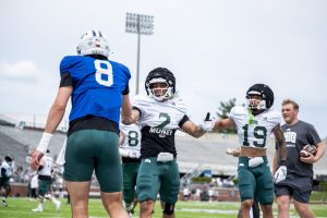 Preston Bowman celebrates with Nick Poulos after drill during Ohio spring game