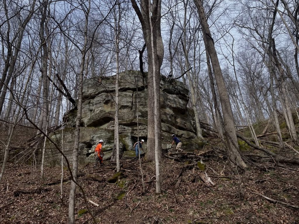 Volunteers with Climb Athens work to prepare the park for sport climbing. 