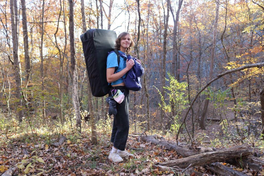 Ohio University freshman Alex Beasley stands with her climbing gear. 