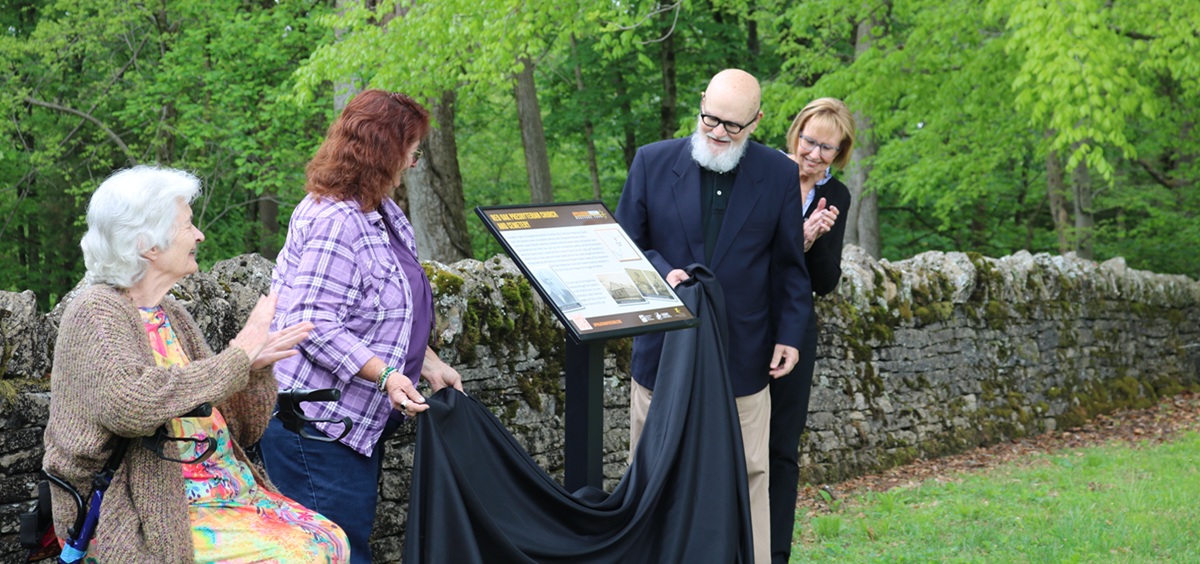 Members of Red Oak's congregation unveil a historical marker.