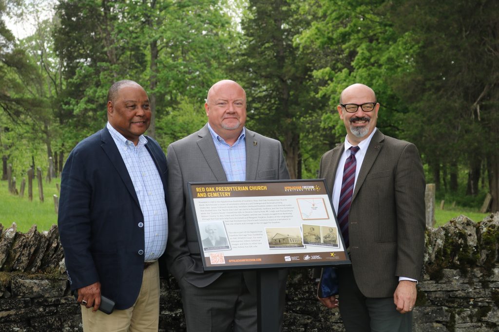 Marshall University Assistant Provost Cicero Fain III, Feight and Conley stand by the new freedom tour marker at Red Oak. 